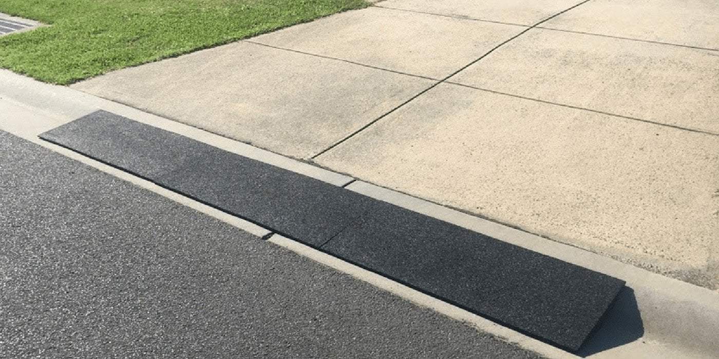 kerb ramp installed between driveway and road
