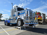 Kenworth prime mover with its front steer wheels raised on Sureweld truck wheel riser ramps