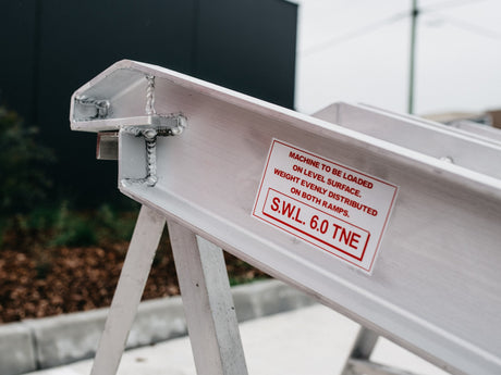 AusRamp 6-tonne ramp hook end on a stand with the S.W.L. 6.0 tonne load decal