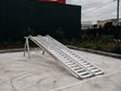 AusRamp 4.5-tonne aluminium loading ramps, pair set up on a stand