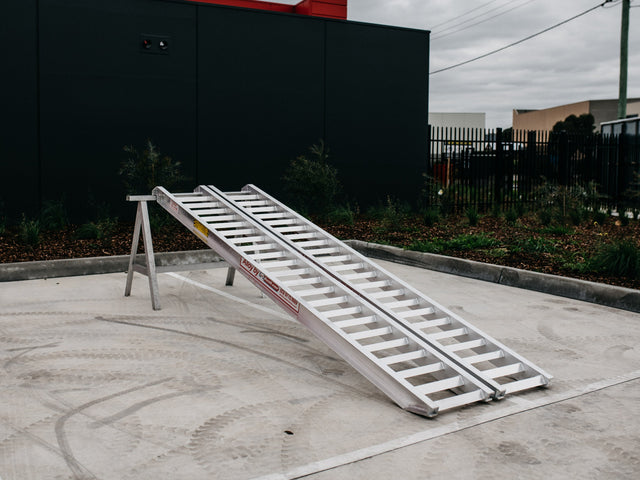 AusRamp 4.5-tonne aluminium loading ramps, pair set up on a stand