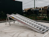 AusRamp 8-tonne aluminium loading ramps, pair set up on a stand