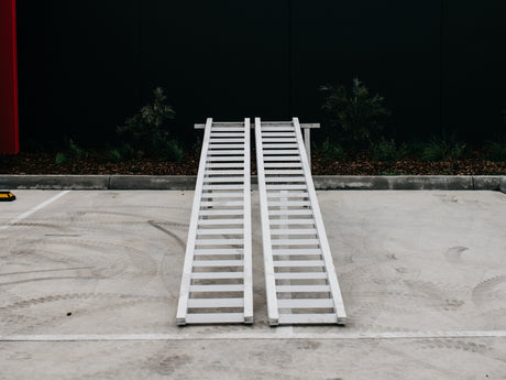 AusRamp 3-tonne aluminium loading ramps, pair set up on a stand, front view