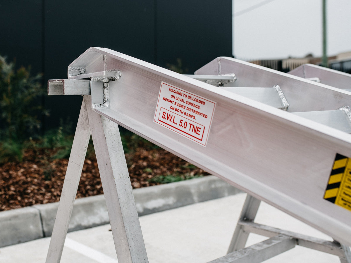 AusRamp 5-tonne ramp hook end on a stand with the S.W.L. 5.0 tonne load decal
