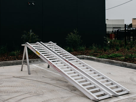 AusRamp aluminium loading ramps pair on a stand, side angle