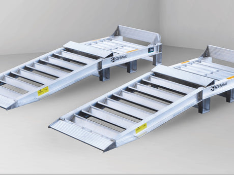 Close-up of the truck wheel riser ramps for single axle rear wheels showing the raised platform, wheel stop and approach ramp
