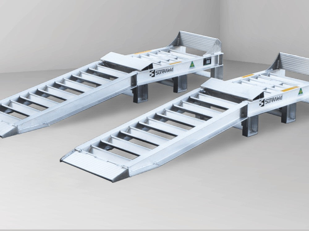 Close-up of the truck wheel riser ramps for front wheels showing the raised platform, wheel stop and approach ramp
