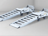 Close-up of the truck wheel riser ramps for front wheels showing the raised platform, wheel stop and approach ramp