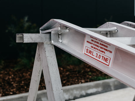 AusRamp 3-tonne ramp hook end on a stand with the S.W.L. 3.0 tonne load decal