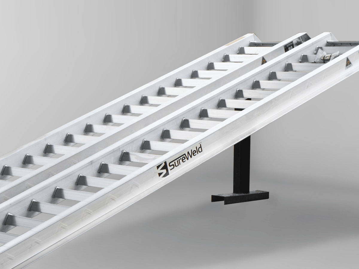 Close-up of the raised rungs on a Sureweld Track Series ramp, built for steel tracks