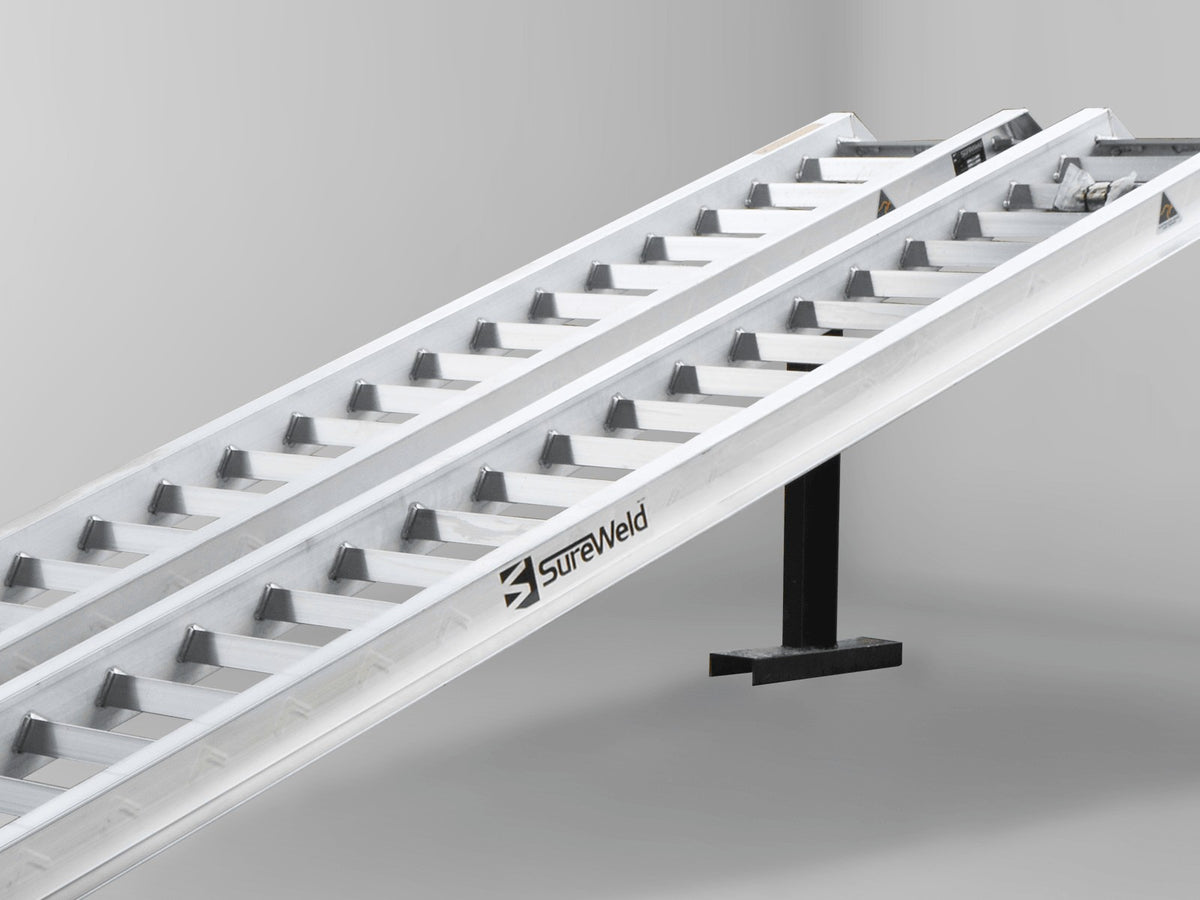Close-up of the raised rungs on a Sureweld Track Series ramp, built for steel tracks