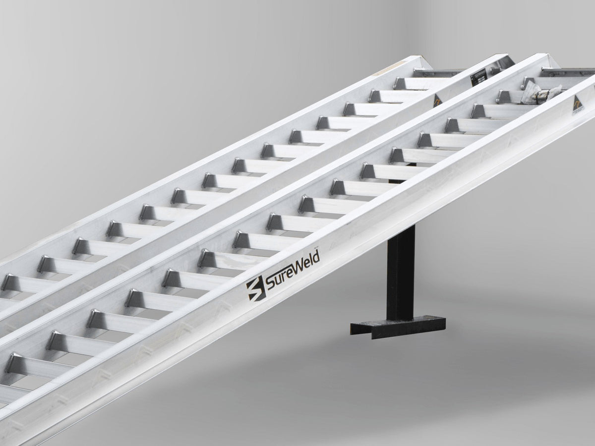Close-up of the raised rungs on a Sureweld Track Series ramp, built for steel tracks