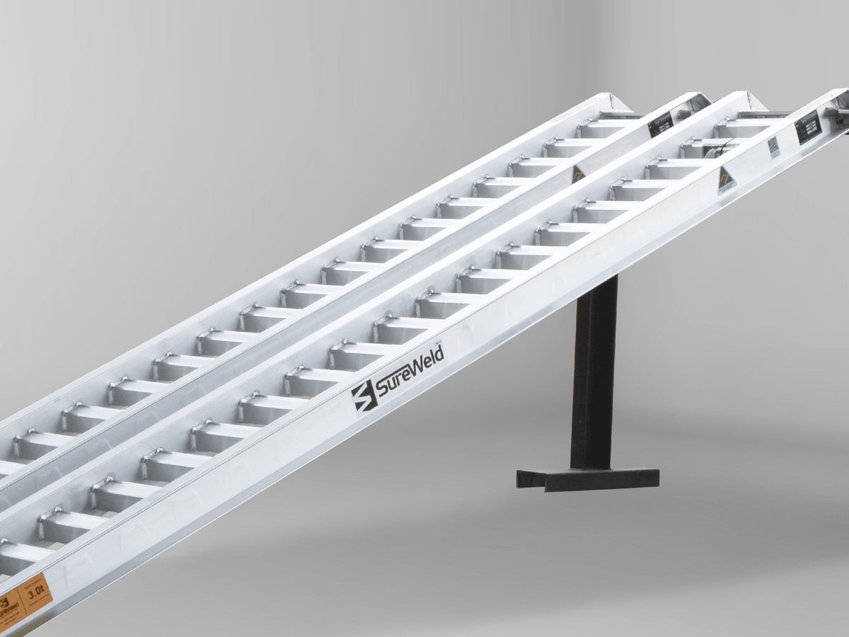 Close-up of the rungs on a Sureweld PT Series ramp, shaped for rubber-track loaders