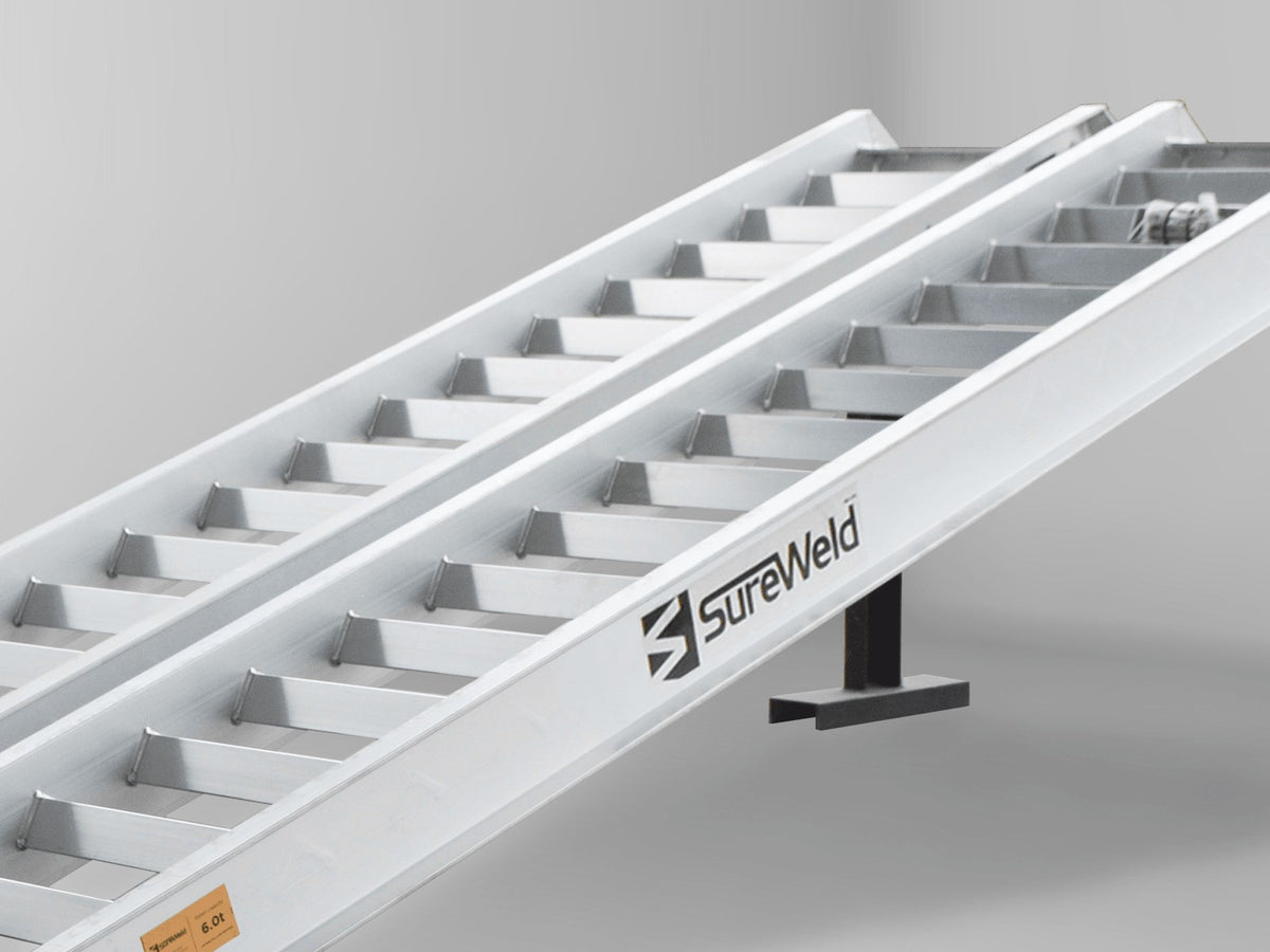 Close-up of the raised rungs on a Sureweld Track Series ramp, built for steel tracks