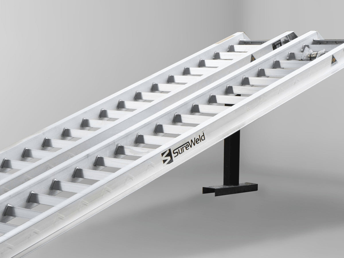 Close-up of the raised rungs on a Sureweld Track Series ramp, built for steel tracks