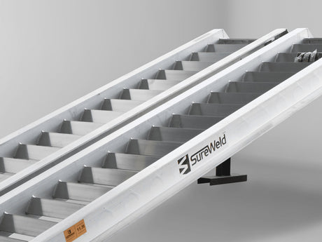 Close-up of the raised rungs on a Sureweld Track Series ramp, built for steel tracks