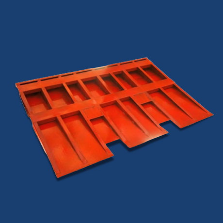 Underside view of the orange ramp, revealing reinforced structural ribbing for added strength.