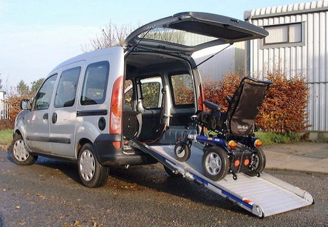 WM System Aluminium AL-Light Van Ramp with Swivel, 400kg Capacity - power wheelchair going up the ramp into a small van