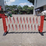 Expanded open Base Guard 3m Expandable Plastic Safety Barrier with Rubber Base in an outdoor scene