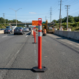Roadwork on a highway with traffic cones and barriers