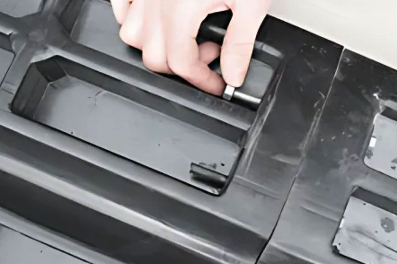 a hand screwing the bolt to tighten the joints