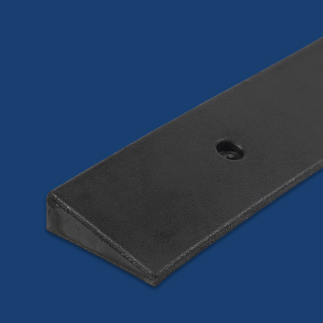 Close-up corner detail of the ramp, set against a dark blue background.