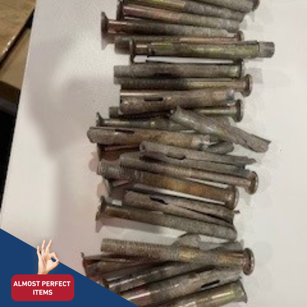 Close-up of a pile of used or imperfect metal bolts, shown as “Almost Perfect Items.