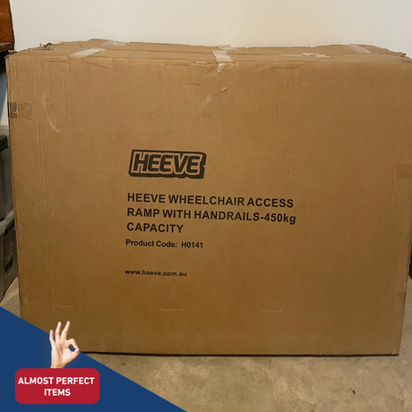 Cardboard box with 'HEEVE' branding and product details on a concrete floor.