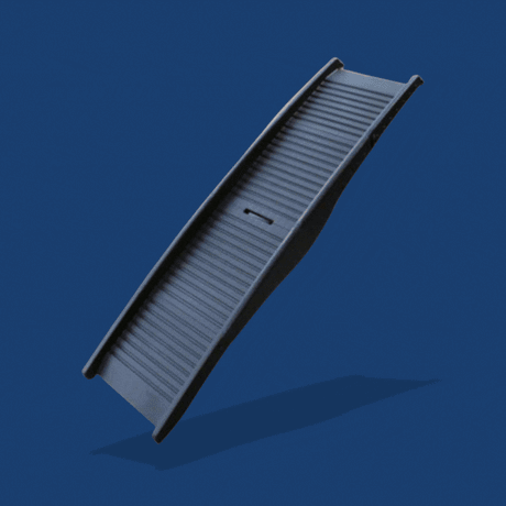 Black folding dog ramp with a ribbed surface and carry handle on a blue background.