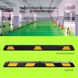 Parking garage with speed bumps and safety cones, featuring a close-up of a speed bump with 'Chevron' branding.