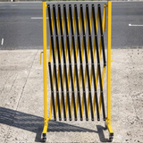 Yellow and black safety barrier on a road