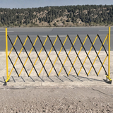 Black and yellow safety barrier on a road with a scenic background