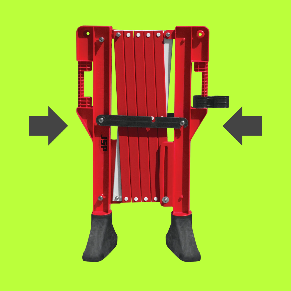 Red mechanical device with black components on a green background