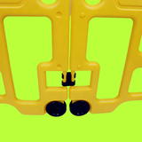 Yellow plastic barrier with green background