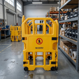 Yellow barrier with 'No Entry' sign in a warehouse setting