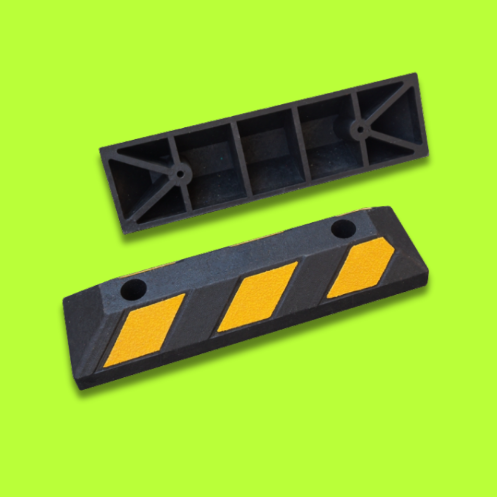 Base Guard® 550mm Rubber Wheel Stop on a green background