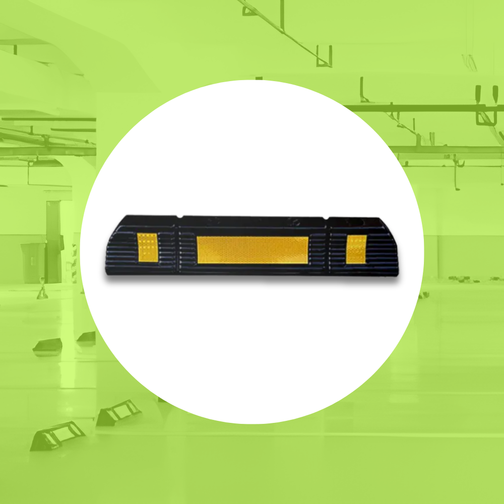 Base Guard® 600mm Rubber Wheel Stop on a green background