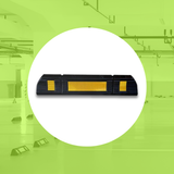 Base Guard® 600mm Rubber Wheel Stop on a green background