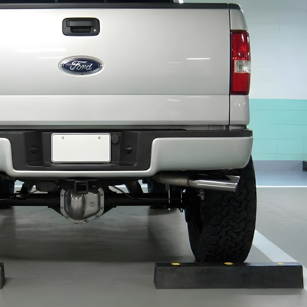 Ford truck with a hitch and bumper in a showroom setting