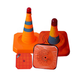 Two orange traffic cones with reflective stripes and red lights on a white background.