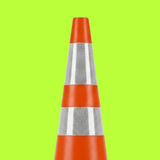 Orange traffic cone with reflective stripes on a green background