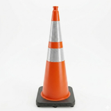 Orange traffic cone with reflective silver band on a white background