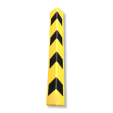 A yellow safety bollard with four black chevron stripes, shown vertically on a plain white background.