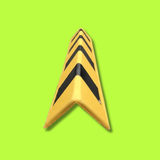 A yellow V-shaped traffic safety barrier with bold black chevron stripes, shown on a solid lime green background.