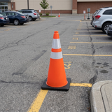 Base Guard Reflective Traffic Cone with High Strength Film on a parking lot