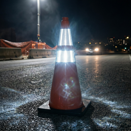 Base Guard Reflective Traffic Cone with High Strength Film on a parking lot during night time