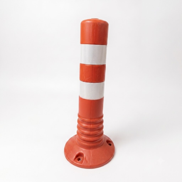 Orange traffic cone with reflective white stripe on a white background