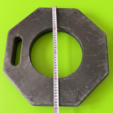 Hexagonal metal washer with a measuring tape on a green background