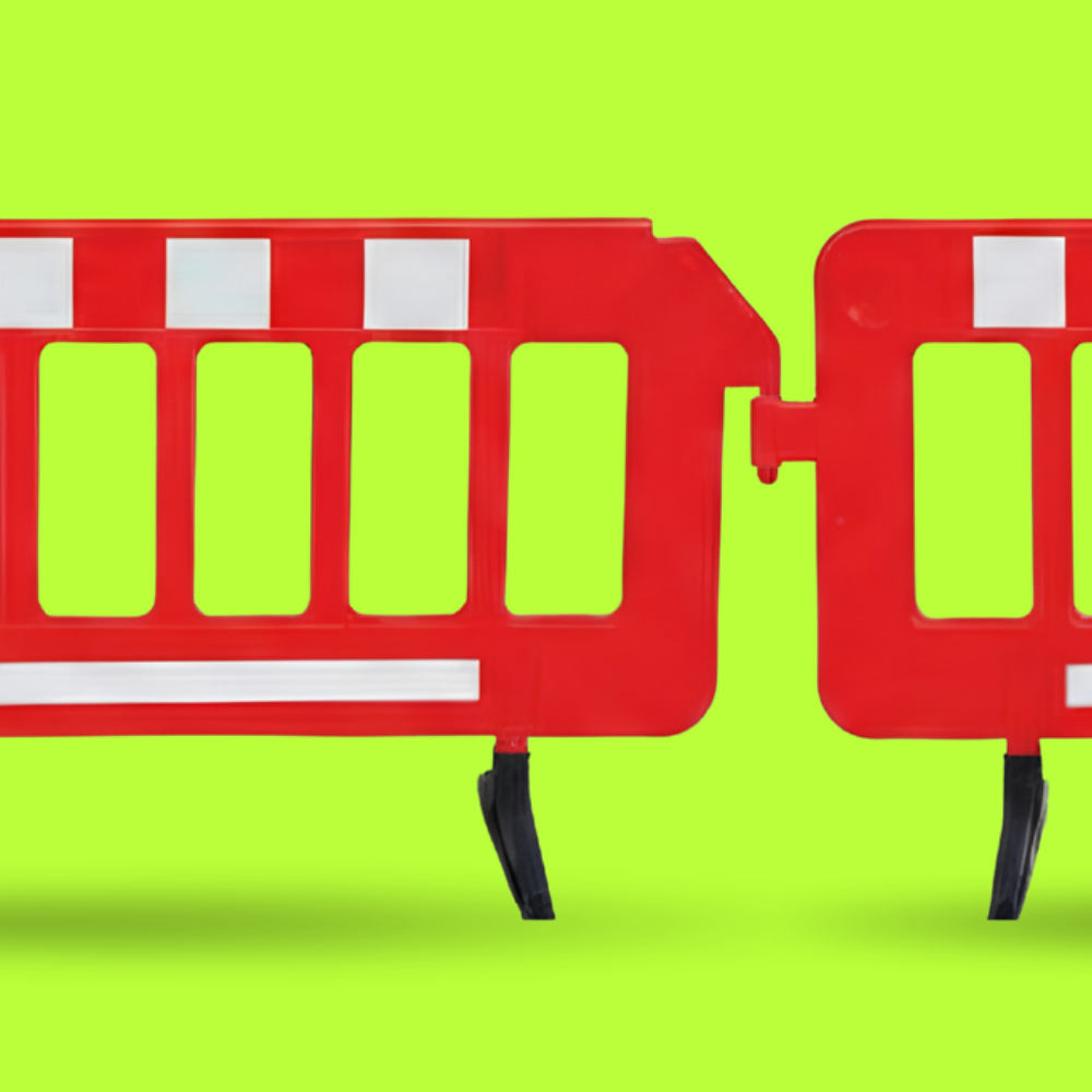 Red barriers with white stripes on a bright green background