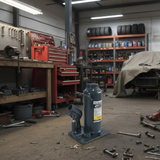 Bottle jack in a workshop with tools and equipment around